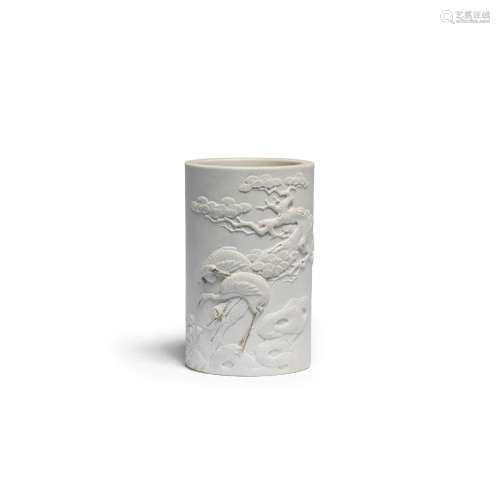 A FINE WHITE BISCUIT PORCELAIN 'CRANES AND PINE' BRUSHPOT, B...