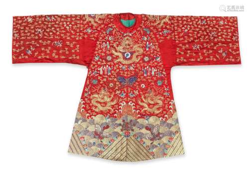 A CORAL-RED-GROUND EMBROIDERED SILK THEATRICAL WEDDING ROBE,...