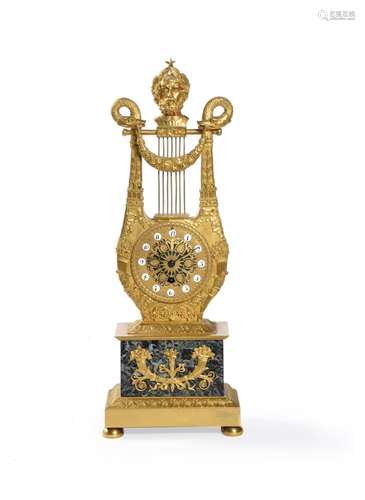 AN EMPIRE FRENCH GILT METAL MANTEL TIMEPIECE