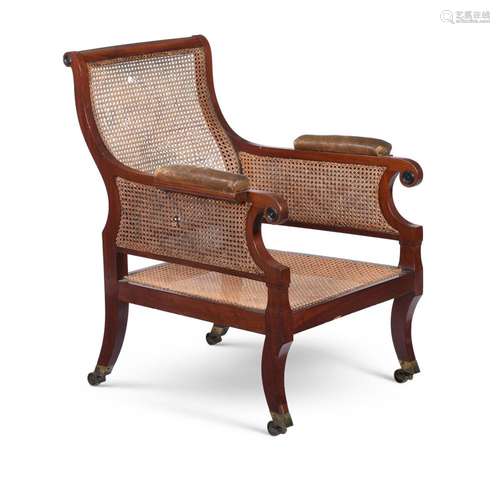 A MAHOGANY LIBRARY ARMCHAIR IN REGENCY STYLE