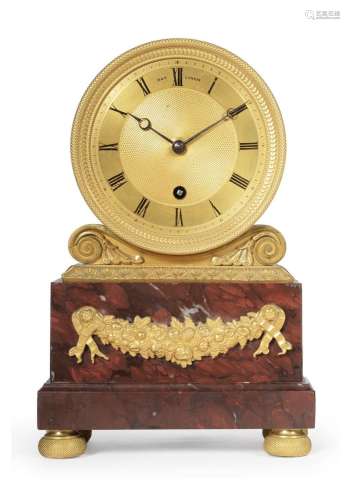 Y A GILT-METAL AND RED-MARBLE MOUNTED MANTEL TIMEPIECE IN DR...