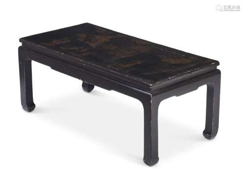 A BLACK LACQUERED LOW CENTRE TABLE