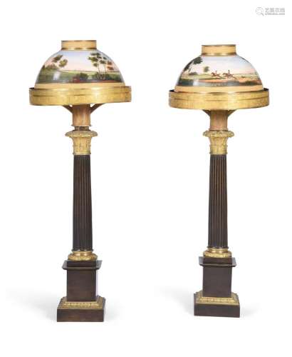 A PAIR OF PATINATED AND GILT METAL TABLE LAMPS IN EMPIRE STY...