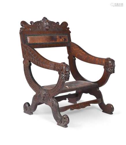 A CARVED WLANUT LOW ARMCHAIR