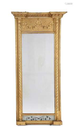 A GILTWOOD AND COMPOSITION WALL MIRROR