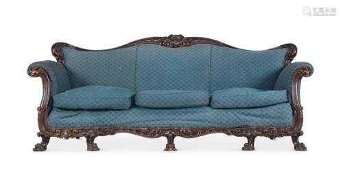 A VICTORIAN CARVED WALNUT SOFA