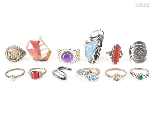 TWELVE ASSORTED SILVER RINGS