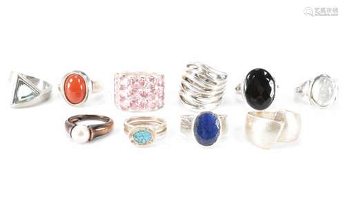 TEN SILVER STONE SET RINGS