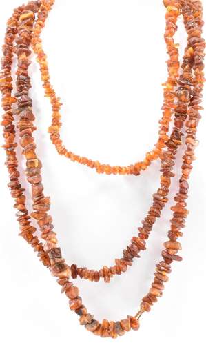 TWO EARLY 20TH CENTURY AMBER NUGGET NECKLACES