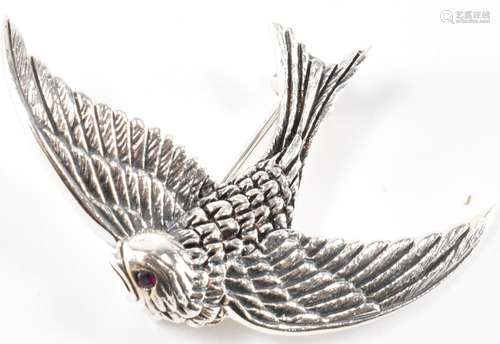 A SILVER LADIES BROOCH IN THE SHAPE OF A SWALLOW WITH RUBY T...