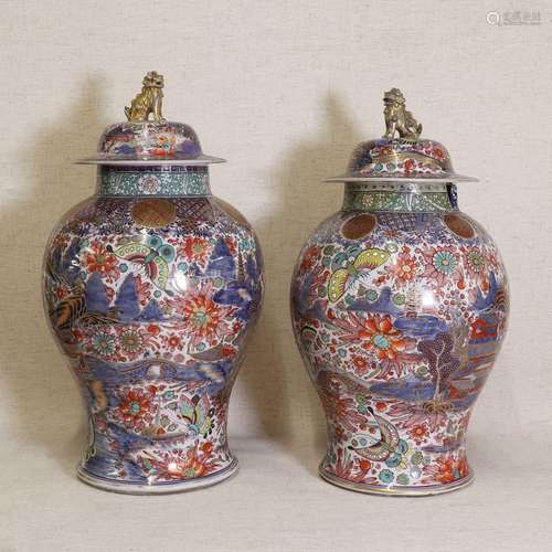 Two Chinese clobbered blue and white vases and covers,