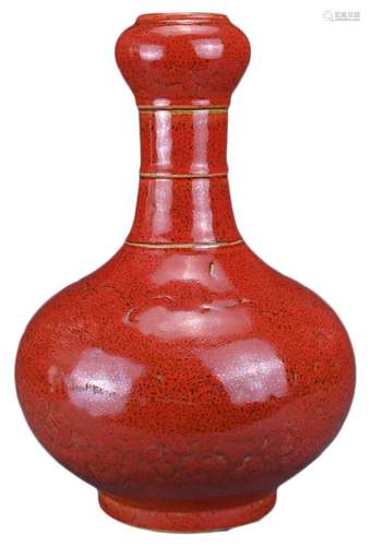 A CHINESE CORAL-GROUND 'GARLIC-MOUTH' VASE