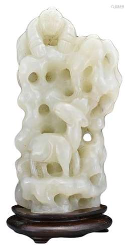 A CHINESE PALE CELADON JADE CARVING ON WOODEN STAND