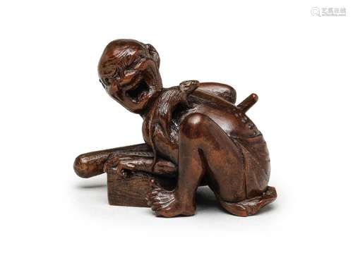 A WOOD OKIMONO (TABLE ORNAMENT) OF A DISAPPOINTED RAT CATCHE...