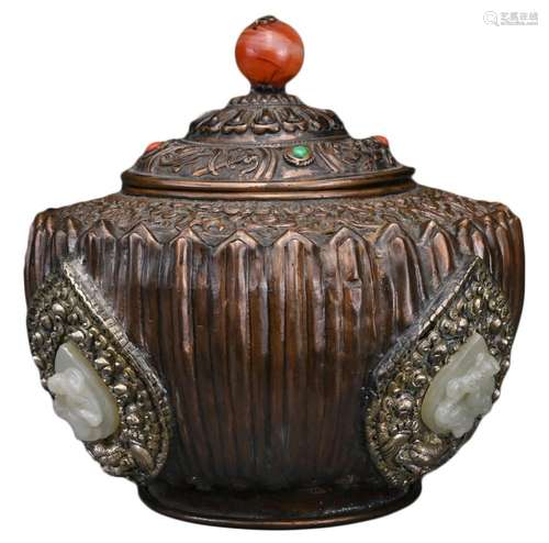 A TIBETAN COPPER REPOUSSÉ BOX AND COVER