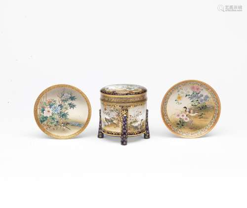 TWO SATSUMA SAUCER DISHES AND A CYLINDRICAL KARABITSU (STORA...