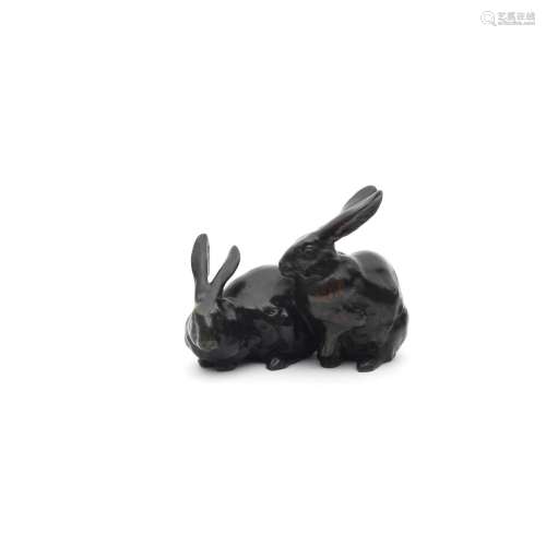 A BRONZE OKIMONO (TABLE ORNAMENT) GROUP OF TWO RABBITS By Hi...