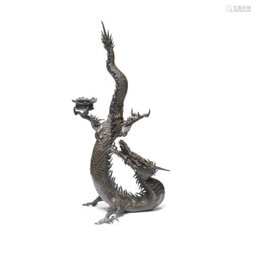A BRONZE CANDLESTICK HOLDER IN THE FORM OF A DRAGON By Toun,...
