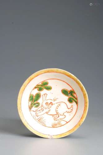 A rabbit patterned red and green porcelain plate