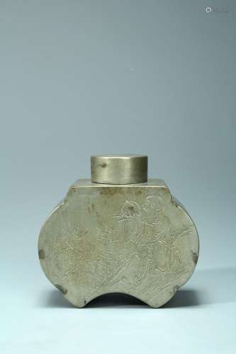 A tin tea canister carved figure