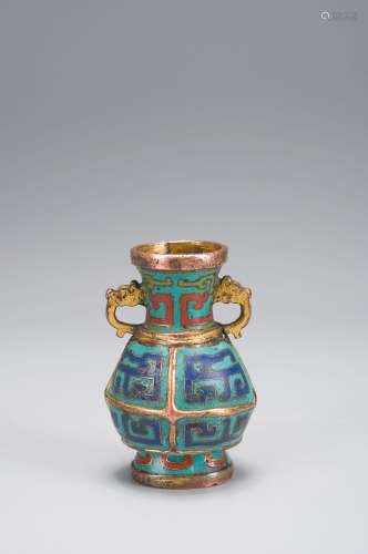 A cloisonne flower holder with dragon shaped ears