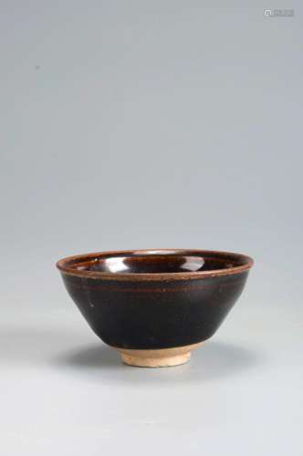 A brown glazed porcelain cup