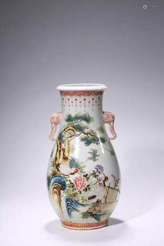 A famille rose pine and crane porcelain vase with elephant h...