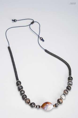 A string of sardonyx beads