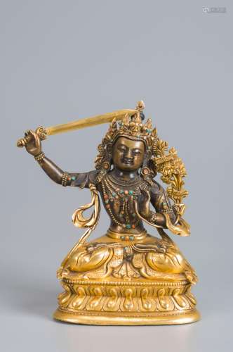 A gilding copper Manjushri statue