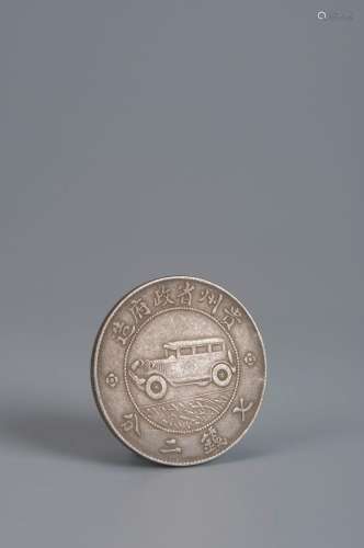 A car patterned silver coin