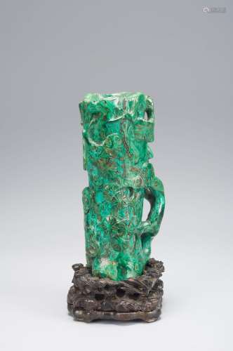 A malachite flower holder with pedestal