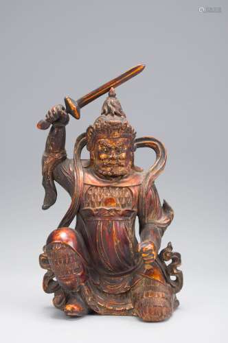 A gilt wood buddha statuette