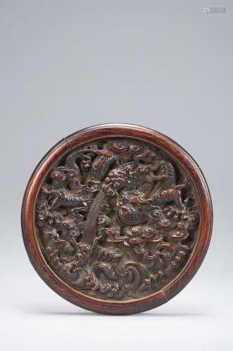 A dragon patterned wood ornament