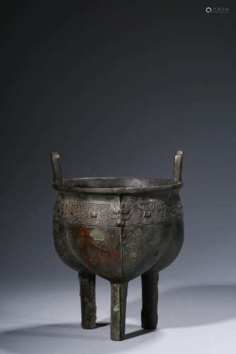 A three-legged double-eared bronze pot