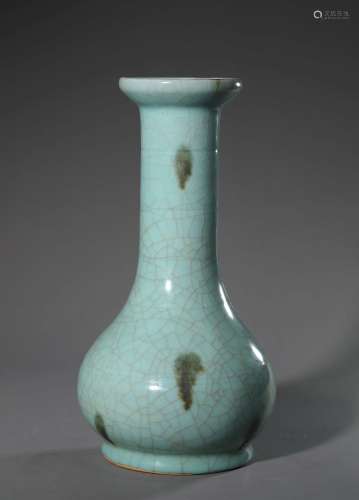 A green glazed brown spotted porcelain vase