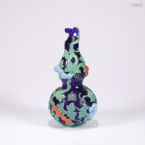 A gourd-shaped glass vase