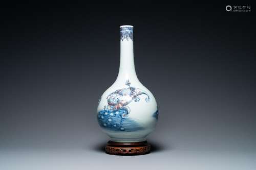 A Chinese blue, white and copper-red bottle vase with Buddhi...