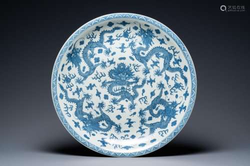 A massive Chinese blue and white 'dragon' dish, Kangxi mark,...