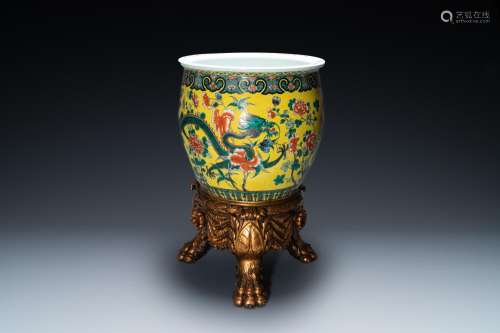 A Chinese yellow-ground famille verte 'dragons' fish bowl on...