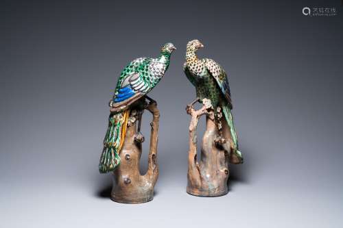 A pair of large Chinese polychrome pottery peacocks on tree ...
