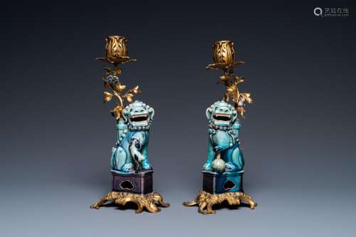 A pair of Chinese turquoise- and aubergine-glazed Buddhist l...