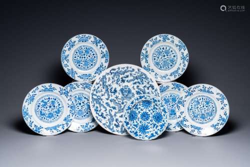 A Chinese blue and white 'dragon' dish and seven floral plat...