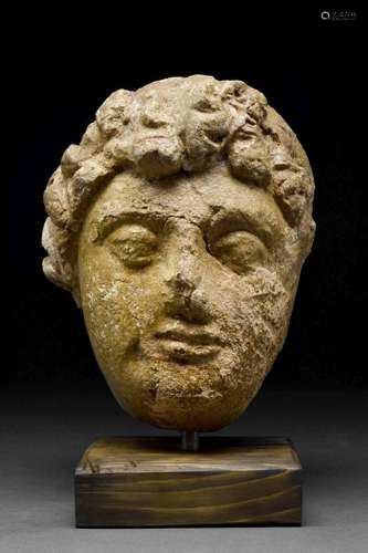 GANDHARAN STUCCO HEAD OF WORSHIPPER OR BODHISATTVA