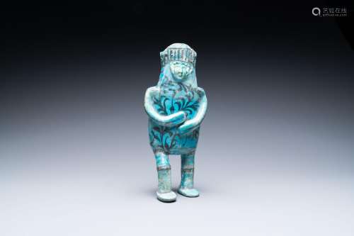 A composite turquoise- and black-glazed pottery figurative e...