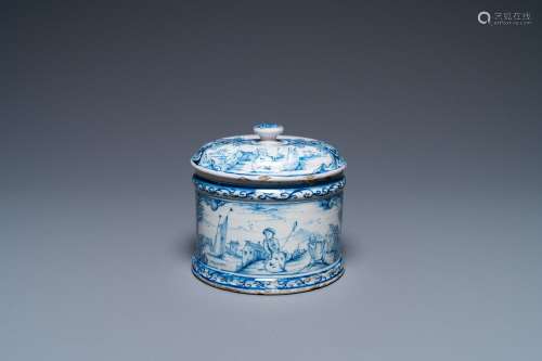 A Dutch Delft blue and white box and cover with fine landsca...