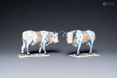 A pair of polychrome Dutch Delft cows on bases with frogs, 1...