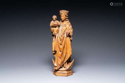 A large carved oak Madonna and child on a crescent moon, The...