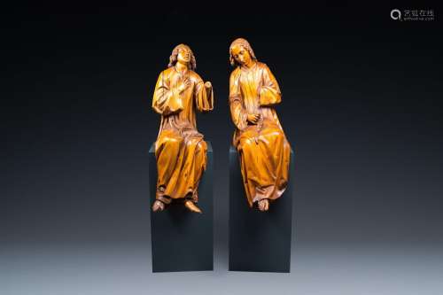 Two impressive Flemish carved oak figures of seated angels, ...