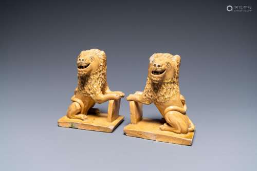 A pair of Flemish or North-French pottery lions, signed and ...