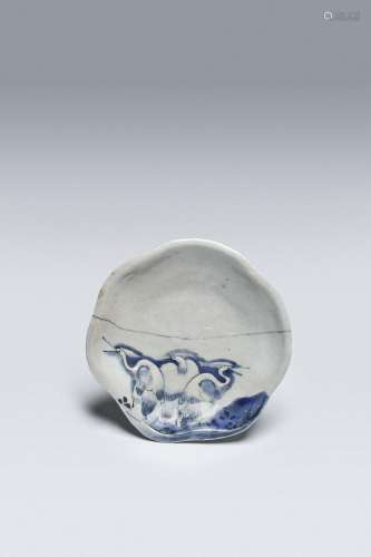 A RARE JAPANESE BLUE AND WHITE MOULDED DISH (MUKOZUKE)